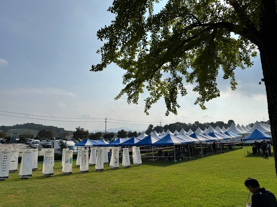 the competition was held at a large grass field with makeshift tents